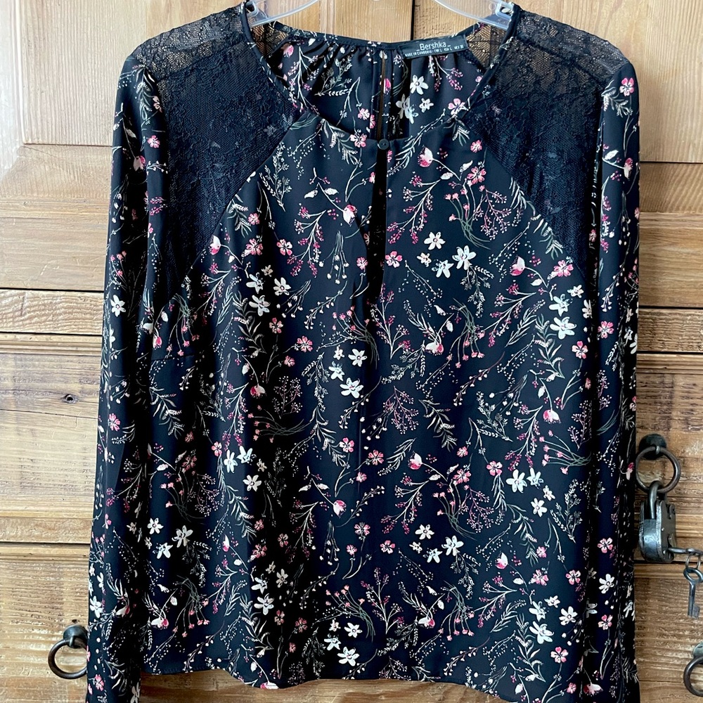 Black floral blouse by Bershka.